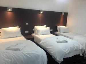 
Кровать или кровати в номере Tartan Lodge
