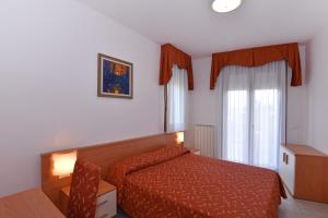 Cama ou camas em um quarto em Hotel Villa Olga