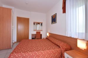 Cama ou camas em um quarto em Hotel Villa Olga