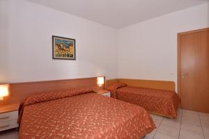 Cama ou camas em um quarto em Hotel Villa Olga