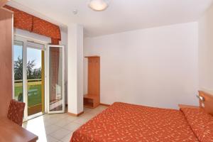 Cama ou camas em um quarto em Hotel Villa Olga