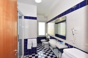 Um banheiro em Hotel Villa Olga