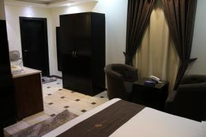 Una cama o camas en una habitación de Dorar Darea Serviced Apartments - Al Malqa