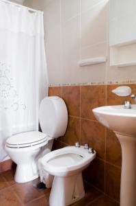 a bathroom with a toilet and a sink at Apartamento Obispo Trejo IV by Lofty in Cordoba