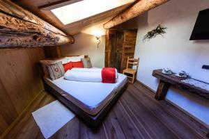 Agriturismo Baita De L'ALL客房内的一张或多张床位
