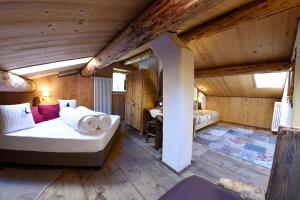 Postel nebo postele na pokoji v ubytování Agriturismo Baita De L'ALL + 27 fotografií