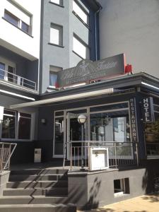 a building with a sign on the front of it at Belle Fontaine in Mondorf-les-Bains