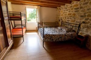 a bedroom with two bunk beds and a window at Domaine du Bourg Gites in Gannay-sur-Loire +58 photos