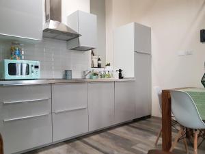 A kitchen or kitchenette at Domus Navigli