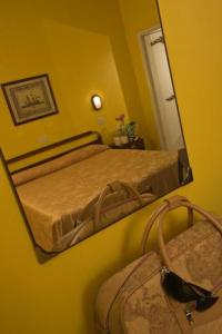 Postel nebo postele na pokoji v ubytování Hotel Maremonti + 2 fotografie