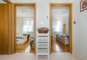 Postel nebo postele na pokoji v ubytování Apartment Qualich
