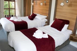 Letto o letti in una camera di Ravine Hotel