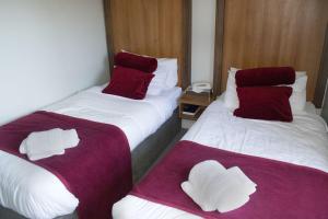 Letto o letti in una camera di Ravine Hotel