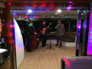 a group of people playing music in a room at Leigh Yacht in Barcelona