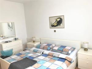 Postel nebo postele na pokoji v ubytování Apartment Qualich