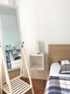 Postel nebo postele na pokoji v ubytování Apartment Qualich