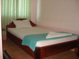 Postel nebo postele na pokoji v ubytování Bun Kao Guesthouse