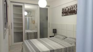 Posteľ alebo postele v izbe v ubytovaní Condomínio Estrela do Mar