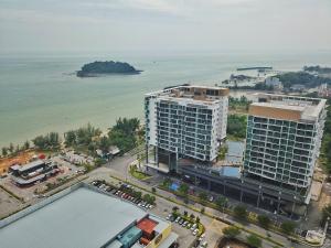 an aerial view of a building next to the water at D'Wharf Hotel & Serviced Residence in Port Dickson