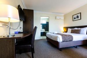 Postel nebo postele na pokoji v ubytování Abcot Inn