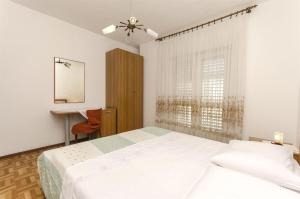 Postel nebo postele na pokoji v ubytování Apartment Niko