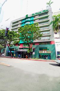 a building on a city street with a traffic light at The Charter House in Manila