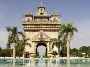 a view of the eiffel tower with palm trees at Intouch Guest House in Vientiane