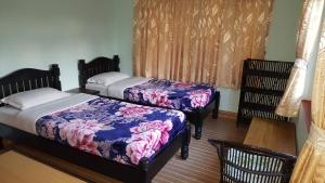 Giường trong phòng chung tại Nanohana Lodge
