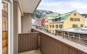 a balcony with a view of a city with buildings at Hotel Rössl-Dependance Neue Post in Schladming +15 photos
