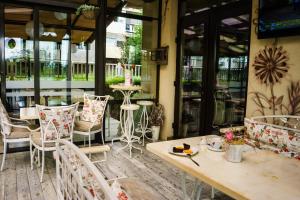 A restaurant or other place to eat at Milano Hotel
