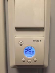 an electronic device with a sign that reads eneroco ns at Koselig Hytte i Hemsedal with outdoor Sauna in Hemsedal