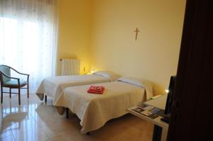 Katil atau katil-katil dalam bilik di Albergo Villa Nobile
