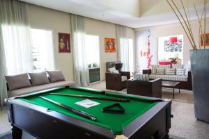 a living room with a pool table at Villa Loanaelle in Marrakesh