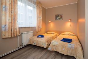 Postel nebo postele na pokoji v ubytování Lilleküla Hotel + 24 fotografií