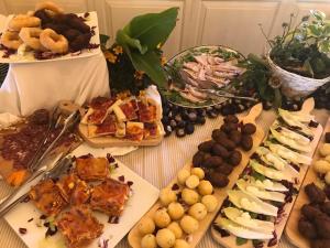 a table topped with lots of different types of food at Agriturismo Montebeltrano in Paterno Calabro