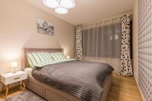 
Łóżko lub łóżka w pokoju w obiekcie Apartment Kremer VI Cracow
