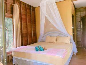 Postel nebo postele na pokoji v ubytování Tha Khao Bay View Bungalow