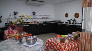 a kitchen with a table with food on it at Jalapão Hotel in Palmas