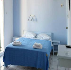 Cama ou camas em um quarto em Alvi Studios