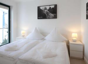 Postelja oz. postelje v sobi nastanitve Villa Friede_Marie_ App_ Svea _Haf