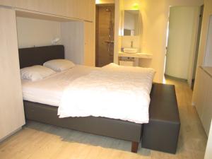 
A bed or beds in a room at Bella Vista First Class
