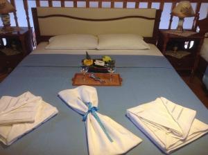 Postel nebo postele na pokoji v ubytování Villa Efraim Amalia
