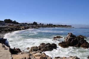 a beach with rocks in the water at Lovers Point Inn in Pacific Grove