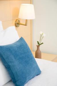 Łóżko lub łóżka w pokoju w obiekcie Hotel Sunshine