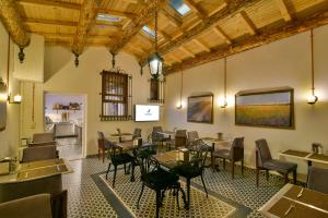 a restaurant with tables and chairs in a room at Istanbul Life Hotel in Istanbul