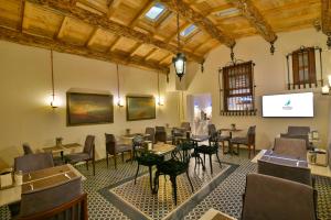 a room with tables and chairs and a projection screen at Istanbul Life Hotel in Istanbul