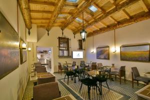 a restaurant with tables and chairs in a room at Istanbul Life Hotel in Istanbul