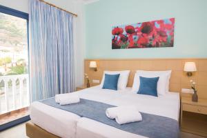 Łóżko lub łóżka w pokoju w obiekcie Hotel Sunshine