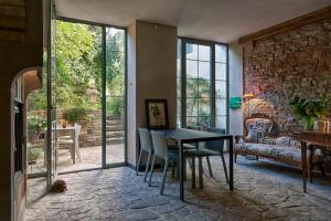 a dining room with a table and chairs at Ottantotto Firenze in Florence