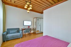 a bedroom with a bed and a chair and a table at Istanbul Life Hotel in Istanbul